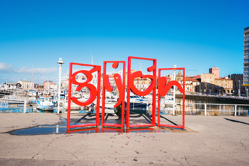 Gijon, Spain - November 19, 2018: Famous red symbol monument in marina of Gijon, Asturias, Spain.