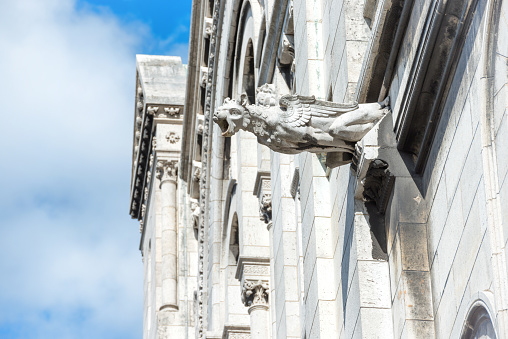 Gargoyle statue on Basilica Coeur Sacre on Montmartre in Paris