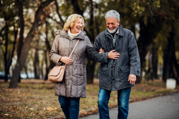 istock Couple walking in a park 1071795498