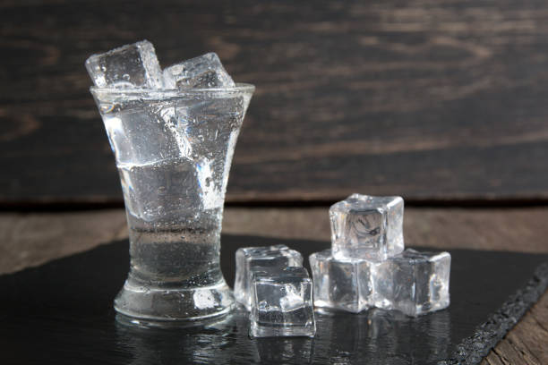 istock russian vodka glass with ice on a dark wooden table 1071796484