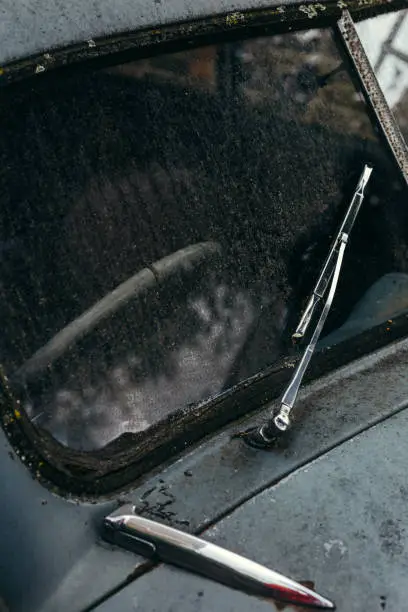 Photo of Windshield and a screen wiper of the old retro car