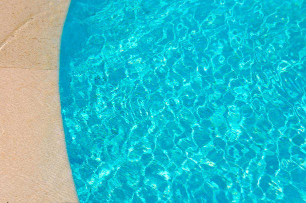 istock blue and clear water in the swimming pool 1071801428