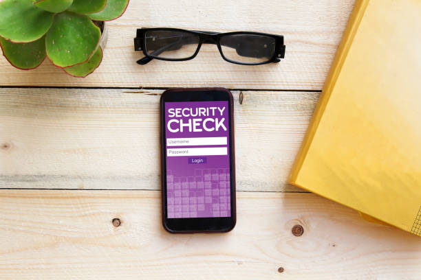 istock cyber security concept on smart phone on wooden table 1071805584