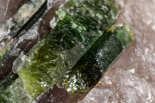 istock Macro mineral tourmaline stone in quartz on a white background 1071806538