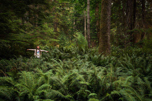 istock Young girl immersed in lush nature 1071812798