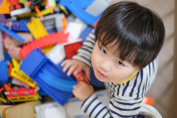 Everyday life of baby with mother and toddler at home