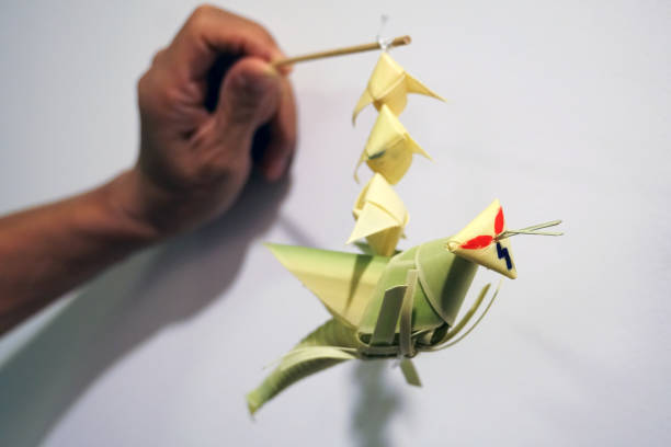 istock thai style palm leaf grasshopper mobile handicraft 1071819998