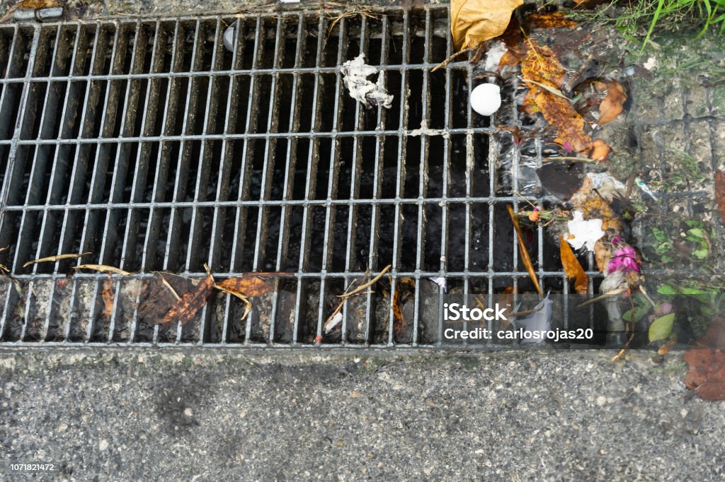 street drainage Street drainage and garbage Drain Stock Photo