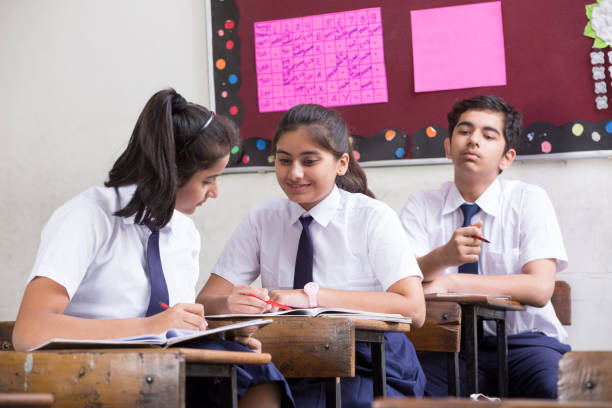 istock Female student in classroom - Stock image 1071825902