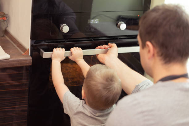 istock Dad and son cooking pizza at home 1071826834