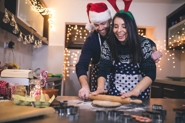 istock Happy couple baking Christmas cookies 1071842144