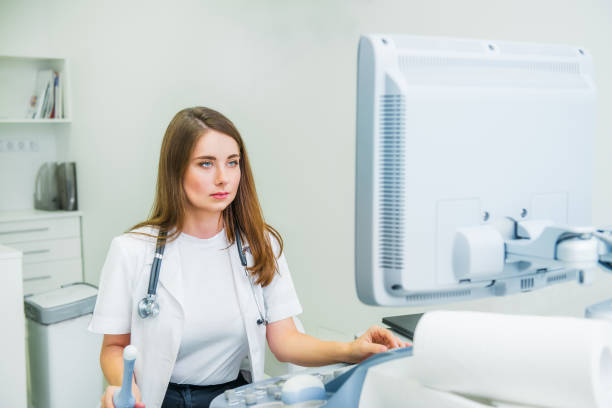 istock Serious, concentrated young doctor, specialist using Ultrasound Scanning Machine for pacient testing. Copy space. Selective focus. 1071853650