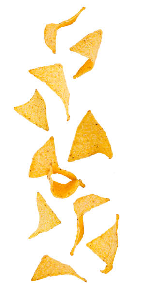 istock Flying potato chips and tomato isolated on white 1071877190