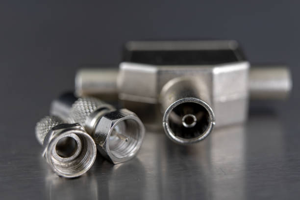 istock Antenna and television connectors on a metal table. Accessories for installing cable television. Dark background. 1071884936