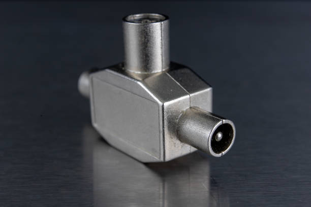 istock Antenna and television connectors on a metal table. Accessories for installing cable television. Dark background. 1071884940