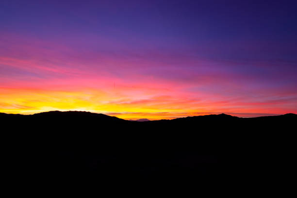 istock Sunset Mountain Silhouette In The Desert 1071885304