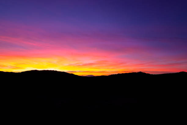 Sunset Mountain Silhouette In The Desert stock photo