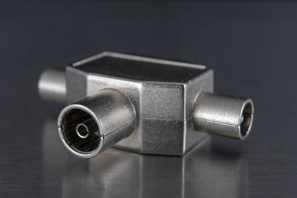 istock Antenna and television connectors on a metal table. Accessories for installing cable television. Dark background. 1071887872