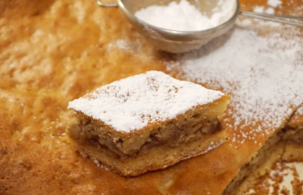 istock Home based bakery. Homemade biscuit cake with apple powdered with ground sugar 1071889302