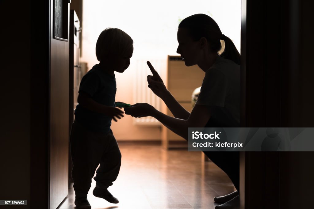 Mom disciplining her child. Teaching-parenting your kid concept. Punishment Stock Photo