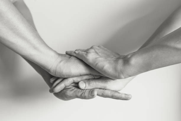 Unity - teamwork Stack of hands showing unity. sea of hands stock pictures, royalty-free photos & images