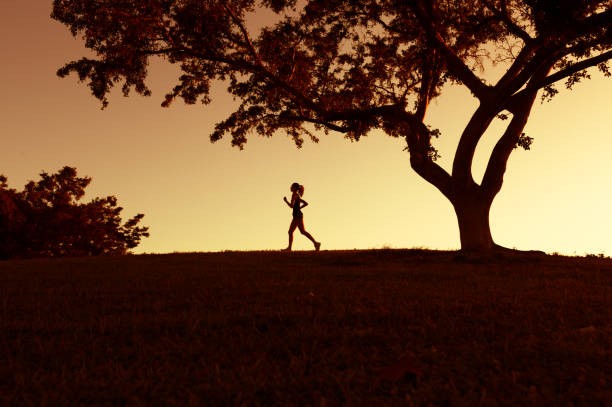 istock Woman running outdoors 1071897016