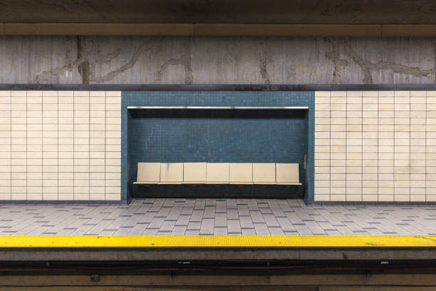 Scene of seats and tiled wall Scene of seats and tiled wall in underground subway station montreal underground city stock pictures, royalty-free photos & images