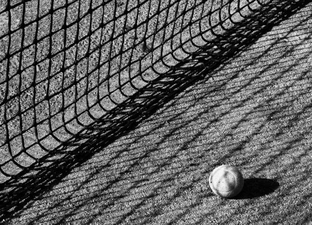 istock tennis ball and net 1071898442