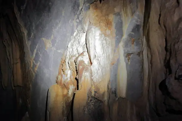Rock formations of grey limestone with speleogens and reddish speleothems of incipient stalactites in St.Paul's Underground River Cave. Puerto Princesa Subterranean River Nnal.Park-Palawan-Philippines
