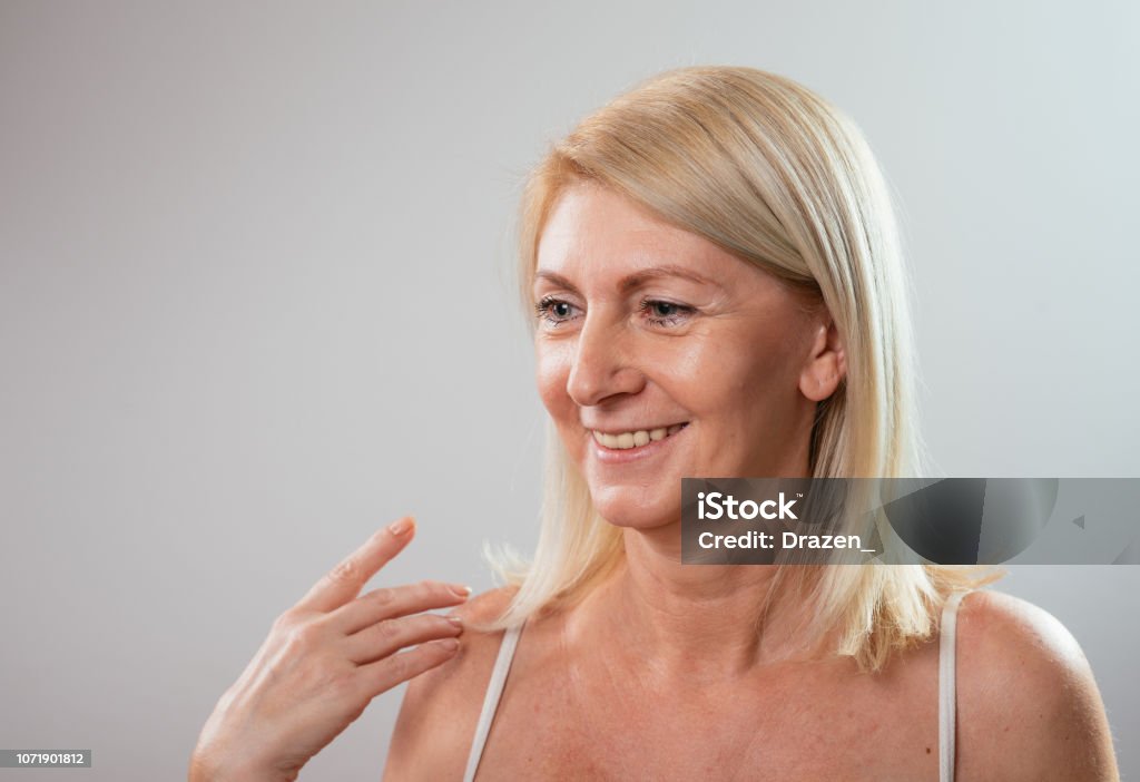 Portrait Of Beautiful Blonde Mature 55 Year Old Woman With Perfect Natural  Skin In Underwear Smiling And Expressing Positive Emotions Stock Photo -  Download Image Now - iStock