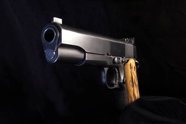 istock Colt 1911 .45 semi-automatic pistol three-quarter view 1071906328