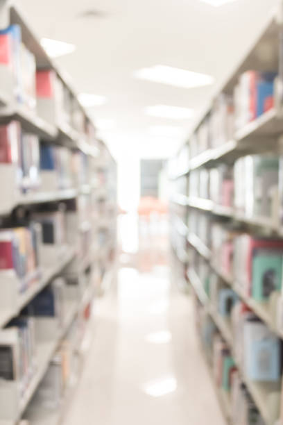 istock Blur school library or study room with book shelves for education background 1071914870