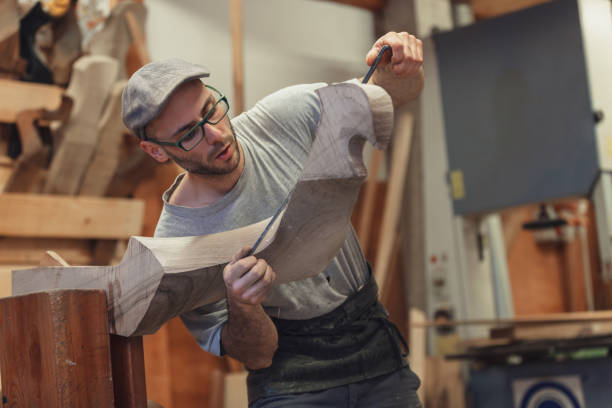 istock Carpenter working on wooden forcola for venetian gondola 1071915436