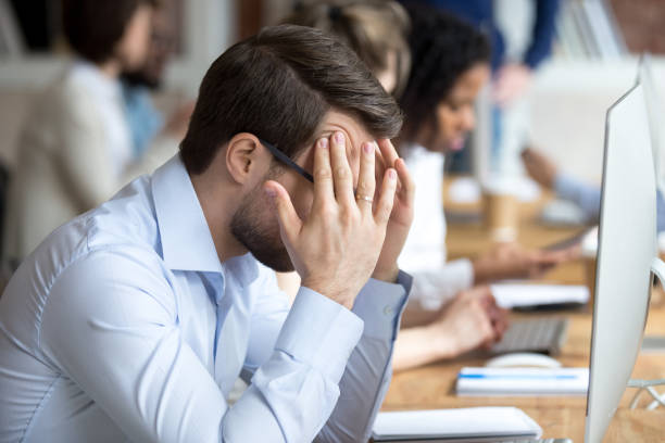 istock Nervous male employee feel anxious at workplace 1071915554