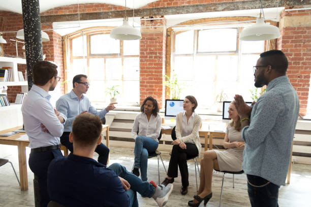 istock Diverse colleagues have fun talking at educational business training 1071915652