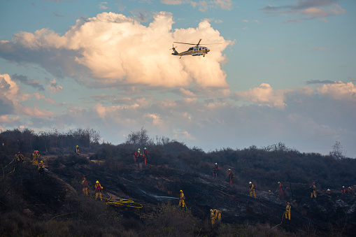 La Habra, California - September 8, 2015: Ground and Aerial Fire Crews make a final assault on a fast moving brush fire.