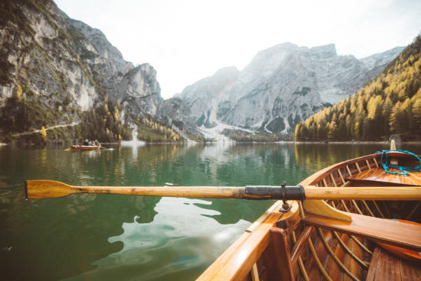 istock Traditional rowing boat on a lake in the Alps in fall 1071921428