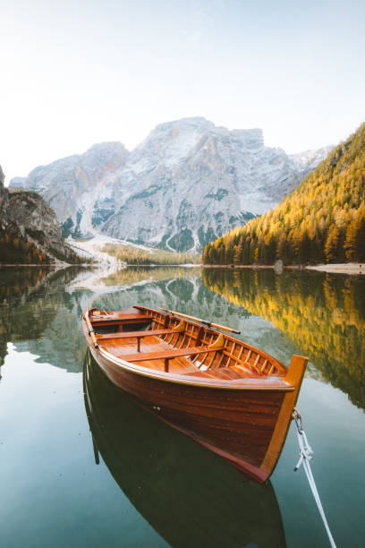 istock Traditional rowing boat on a lake in the Alps in fall 1071921542
