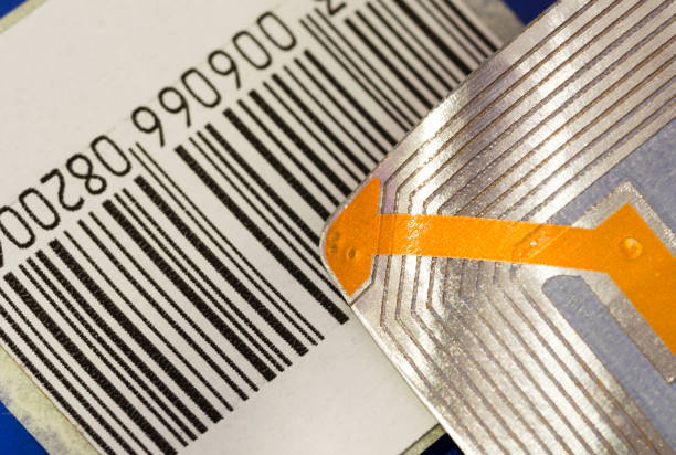 Close up of RFID tags ana a code bar used for tracking and identification purposes and as an anti-theft system in commerce and retail. stock photo