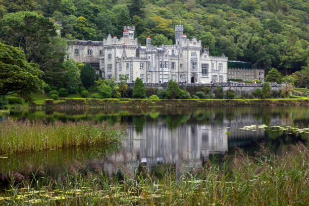 View of Kylemore Abbey in County Galway, Ireland County Galway, Ireland - August 20th 2018: A view of the magnificent Kylemore Abbey - the Benedictine monastery on the grounds of Kylemore Castle in Connemara, County Galway, Ireland. kylemore abbey stock pictures, royalty-free photos & images