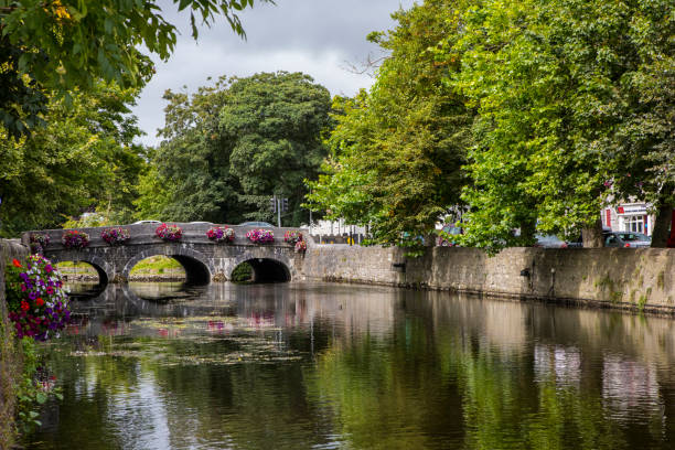 Westport in County Mayo, Ireland County Mayo, Republic of Ireland - August 21st 2018: A bridge over the Carrowbeg River in the beautiful Irish town of Westport. clew bay stock pictures, royalty-free photos & images