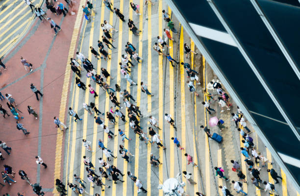 istock People walking on zebra crossing 1071948482