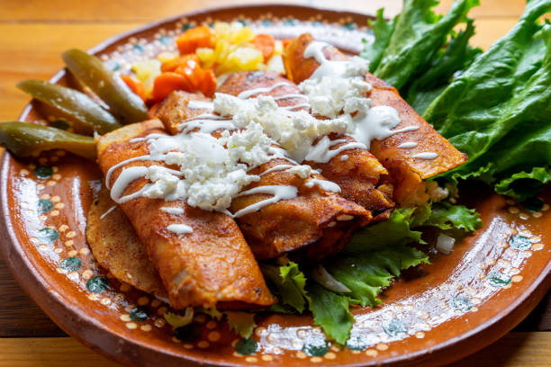 Mexican enchiladas style "Queretanas" Traditional mexican enchiladas style "Queretanas" enchilada stock pictures, royalty-free photos & images