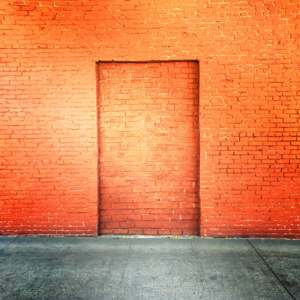 istock Red-Orange Brick Wall with Bricked-in Door 1071971740