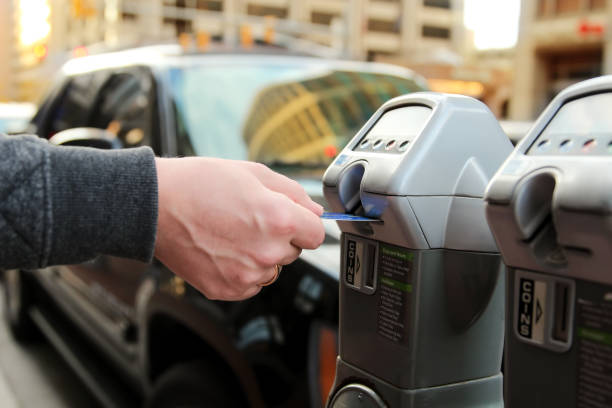 istock man is paying his parking using credit card at  parking pay station terminal 1071972288
