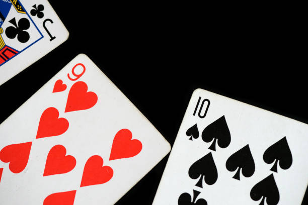 istock Several playing cards on a dark background close up 1071974264