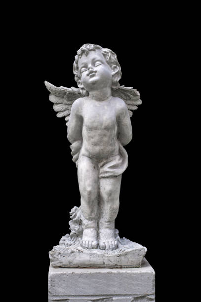 istock closeup cupid sculpture in black background 1071974426