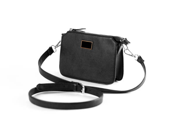 istock Women's small black handbag. Close up. Isolated on white background. 1071976678