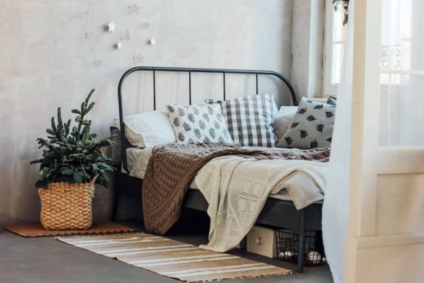 istock The old bed with pillows and knitted blanket. Minimalistic Chris 1071977186