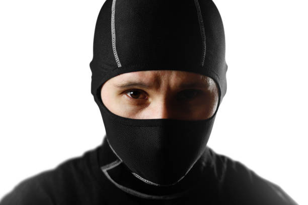 istock The man in the black Balaclava. Close up. Isolated on white background 1071977708